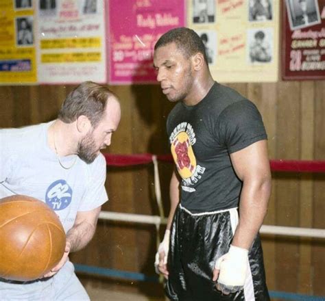 Kevin Rooney works Mike Tyson midsection over with the medicine ball.. Mike Tyson Workout, Mike ...