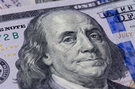 Premium Photo | Closeup of a hundred dollar bill. benjamin franklin's portrait