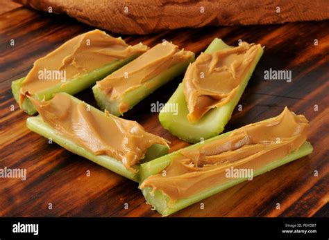 Celery sticks filled with creamy peanut butter Stock Photo - Alamy