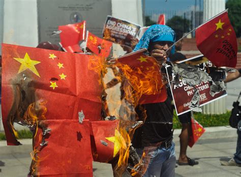 Protesters burn 22 mock China flags - | Manila Today