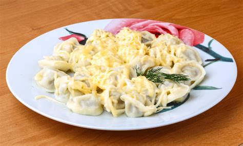 Russian dumplings on the plate and wooden background 12783065 Stock ...