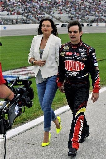 Jeff Gordon and his wife Ingrid Vandebosch walk down pit road during the NASCAR Sprint Cup ...