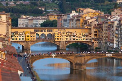 Premium Photo | The ponte vecchio at sunset, in florence.