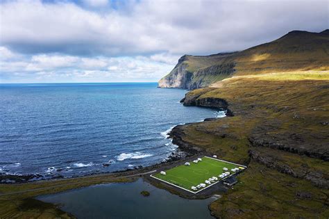 Aerial view of an old football field on the coast near Eidi in Faroe ...