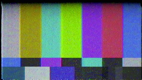 A Flickering, Analog TV Signal With Bad Interference, Static, And Color Bars. Contains Two ...