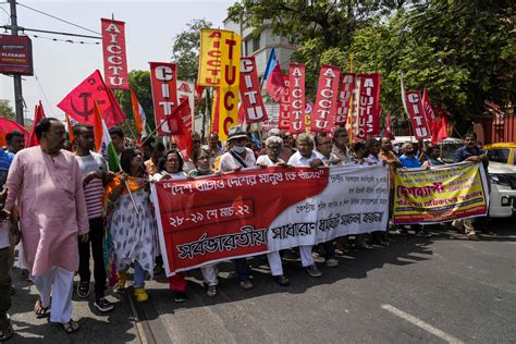 Workers strike across India for labor rights, better pay | AP News