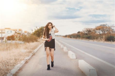 Photography of a Woman Walking on Pavement · Free Stock Photo