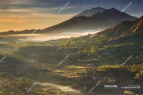 Sunrise over mountain — mist, scenics - Stock Photo | #142177910