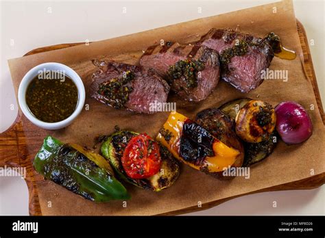 Grilled beef and vegetables with sauce Stock Photo - Alamy