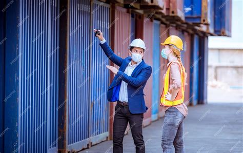 Premium Photo | Portrait team dock workers posing under working and checking production process ...