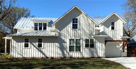 White Farmhouse Style vacation house in New Braunfels, TX. White board & batten siding and trim ...