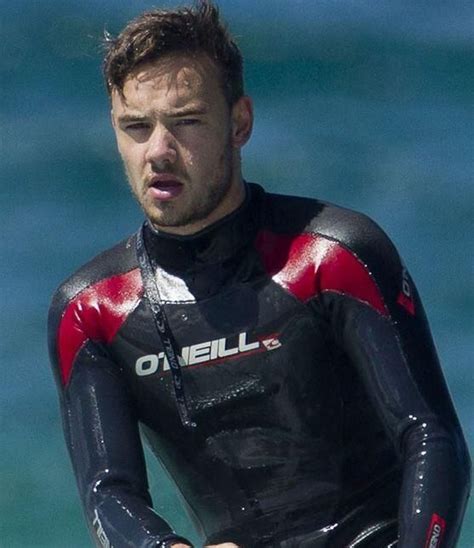 Liam Payne You can basically see his abs through his wet suit. One ...