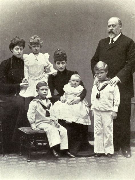 an old black and white photo of a family