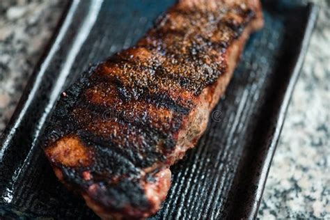 Charred Steak on Blue Black Plate Stock Photo - Image of meat, granite: 149092566