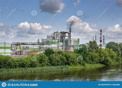 Pipes Of Woodworking Enterprise Plant Sawmill Near River. Air Pollution Concept. Industrial ...