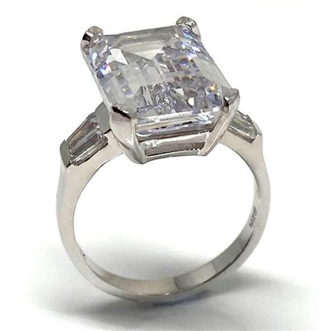 Large fake diamond rings - celebrity emerald cut engagement ring