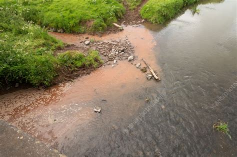 Silt flowing into a river - Stock Image - C057/4796 - Science Photo Library