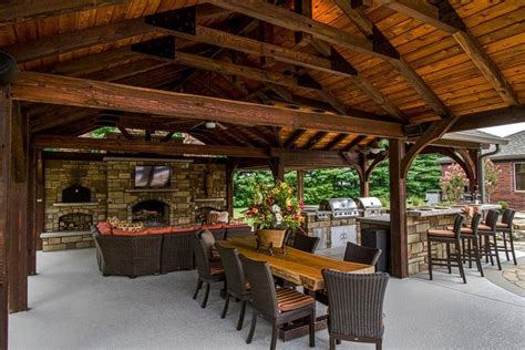 HGTV presents an outdoor entertaining space featuring an open pavilion with TV, kitchen and ...