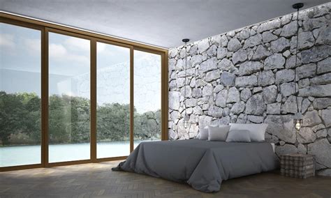 A stone based bedroom wall with outside view