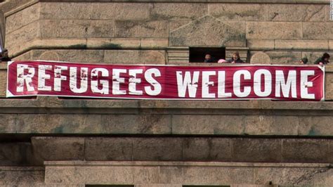 'Refugees Welcome' banner unfurled at Statue of Liberty - CNN.com