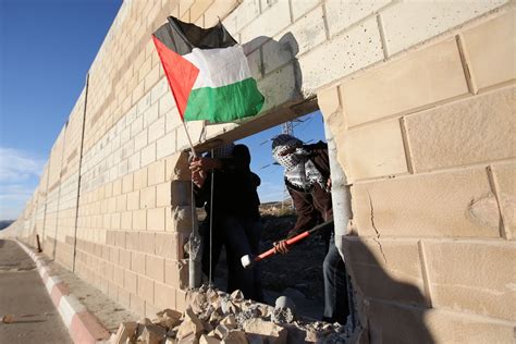 Palestinian Youths Break Through Israeli Partition on Berlin Wall ...