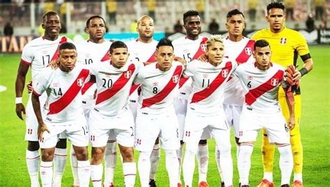 a group of soccer players pose for a team photo