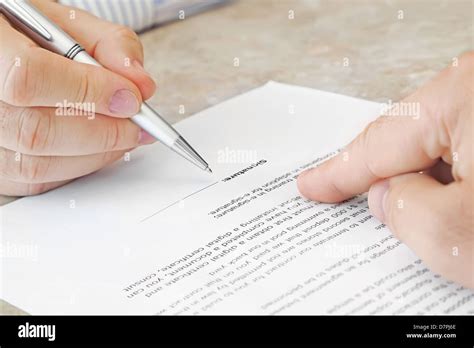 Signing a Document Stock Photo - Alamy