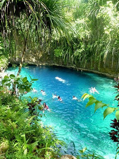 The Hinatuan Enchanted River is known for its clear waters and ...