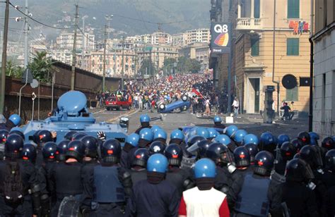 Protesters of the anti-globalization movement come face to face with the police during the G8 ...