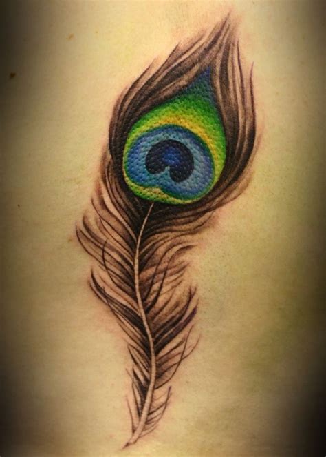 The 25+ best Peacock feather tattoo meaning ideas on Pinterest | Peacock feather meaning ...