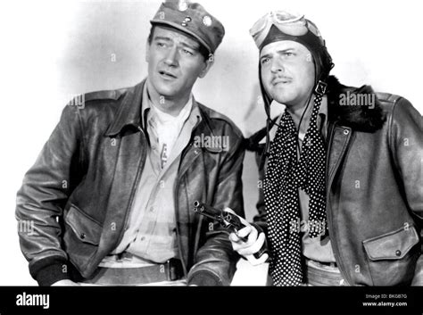 FLYING TIGERS (1942) JOHN WAYNE, JOHN CARROLL FTGS 005 P Stock Photo - Alamy