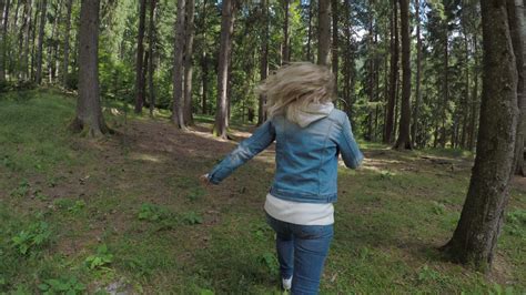 Girl Running Away Scared In Forest