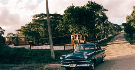 Vintage Car on Dirt Road · Free Stock Photo