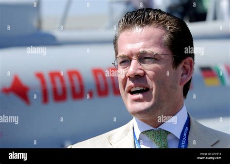 German Minister of Defence Karl-Theodor zu Guttenberg stands in front of an Eurofighter at the ...