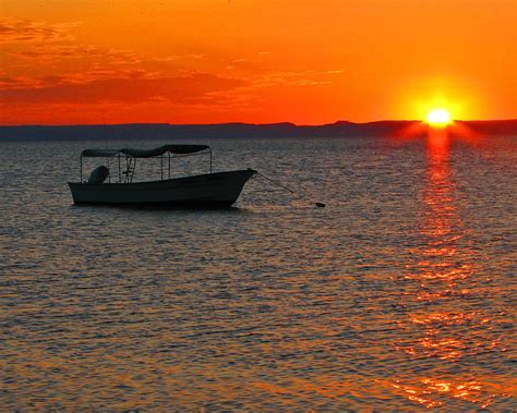 Fishing Boat At Sunset Photograph by Marcia Socolik