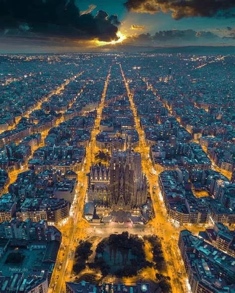 Aerial view of Barcelona at sunset. La Sagrada Familia can be seen ...