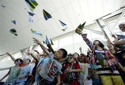 Young participants fly their paper airplanes during the paper airplane ...