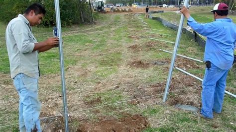 Setting Galvanized Fence Posts - YouTube