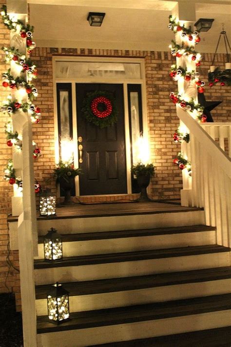 Christmas Front Door.....love the lights in the lanterns on the steps ...