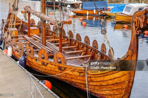 A Perfect Replica Of An Ancient Viking Ship Moored In A Small Harbor In ...