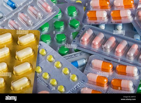 Background collage of colorful pills and capsules of modern medicine. A ...