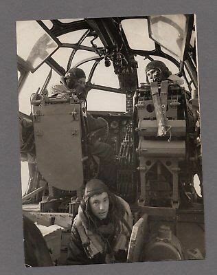 an old black and white photo of some people in the cockpit of a plane or airplane