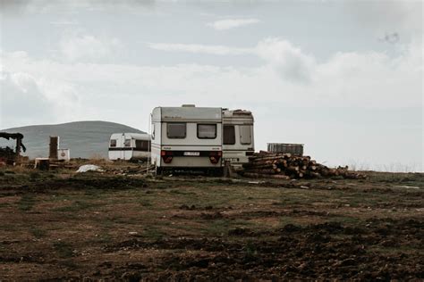 Gray Camper Trailer on Grass Field · Free Stock Photo