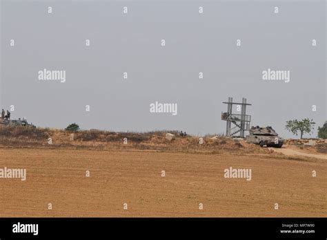 Israeli soldiers on patrol near the border fence between Israel and Palestine, the Gaza Strip ...