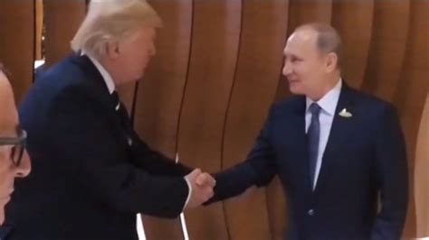 Trump, Putin shake hands at G20 - CNN Video