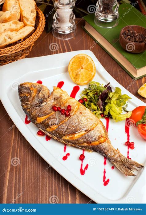 Grilled Whole Fish with Yellow Sauce. Stock Image - Image of plate, parsley: 152186749