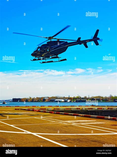 Black Helicopter landing on helipad in Lower Manhattan New York reflex ...