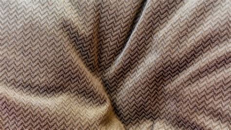 the brown fabric texture as a background 16779593 Stock Photo at Vecteezy