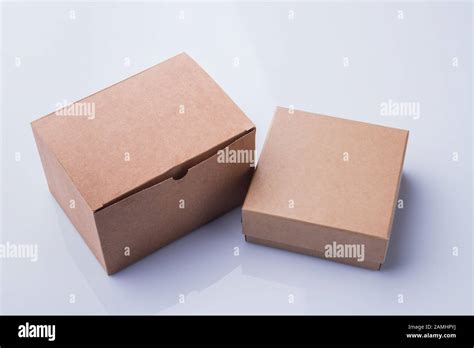 Two different cardboard boxes isolated on white Stock Photo - Alamy