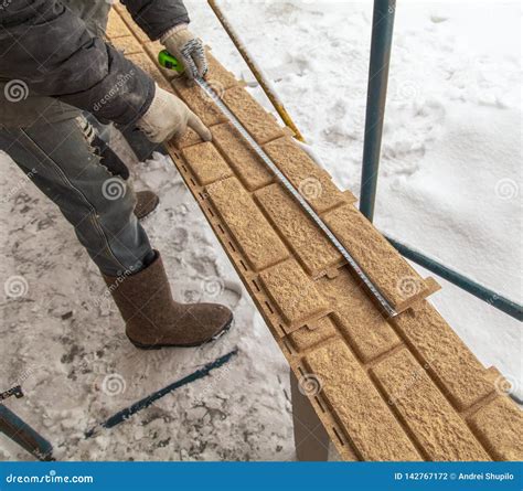 Installing Brick Siding on the Wall of the House Stock Photo - Image of siding, worker: 142767172